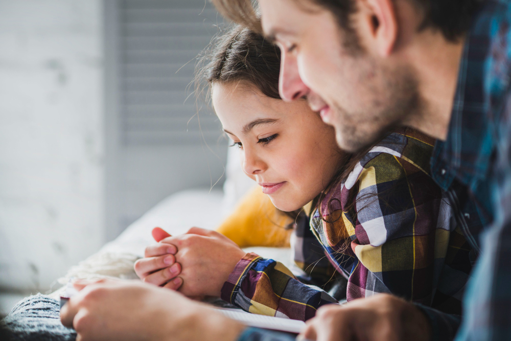 A parent and child reading a letter together.