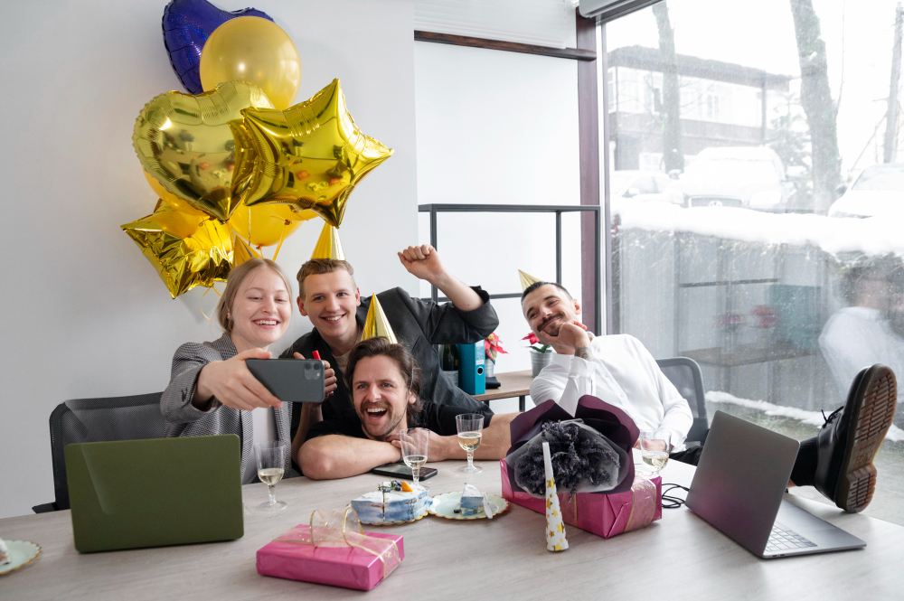 A group photo from an office celebration or an image of colleagues sharing a laugh.